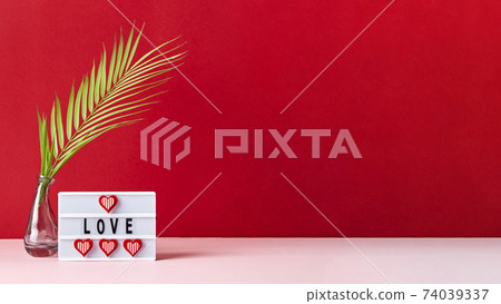 Love lightbox message with red hearts on pink and red background 74039337