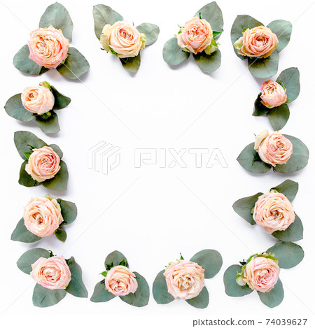 frame made of pink roses, green leaves eucalyptus, branches, floral pattern on white background. Flat lay, top view. Valentine's background. frame made of pink roses, green leaves eucalyptus, branches, floral pattern on white background. Flat lay, top view. Valentine's background. 74039627