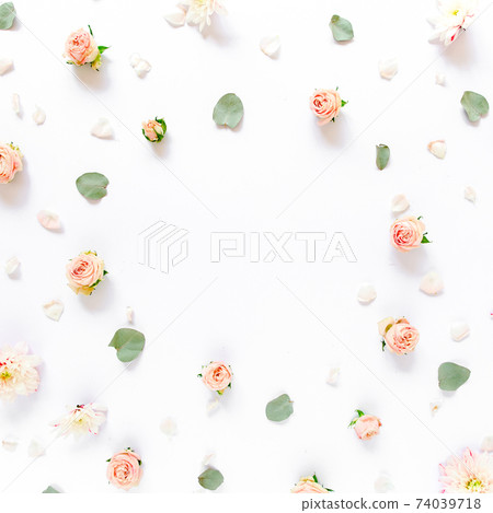 Floral pattern made of pink roses, green leaves, branches on white background. Flat lay, top view. Valentine's background. Floral pattern. Pattern  74039718