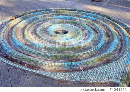Spiral drainage ditch in the park Spiral drainage ditch in the park 74041231