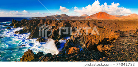 Los Hervideros lava's caves in Lanzarote island, popular touristic attraction. Canary islands Los Hervideros lava's caves in Lanzarote island, popular touristic attraction. Canary islands 74041758