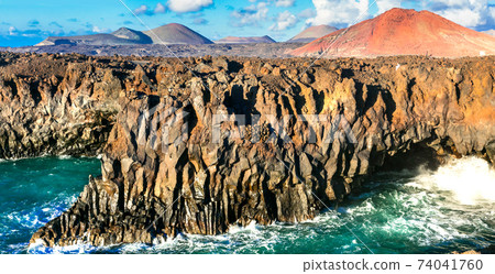 Los Hervideros lava's caves in Lanzarote island, popular touristic attraction. Canary islands Los Hervideros lava's caves in Lanzarote island, popular touristic attraction. Canary islands 74041760