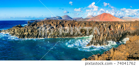 Los Hervideros lava's caves in Lanzarote island, popular touristic attraction. Canary islands Los Hervideros lava's caves in Lanzarote island, popular touristic attraction. Canary islands 74041762