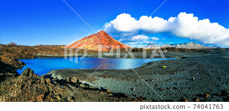 Unique volcanic nature of Lanzarote island with black sands and red mountains. Canary islands Unique volcanic nature of Lanzarote island with black sands and red mountains. Canary islands 74041763