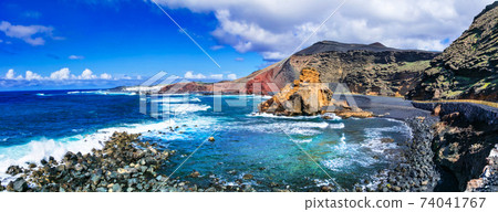 beautiful black beaches and colorful rocks of volcanic island Lanzarote. Canary islands beautiful black beaches and colorful rocks of volcanic island Lanzarote. Canary islands 74041767