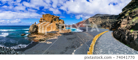 amazing beautiful black beach in volcanic island Lanzarote - El Golfo, Canary islands of Spain amazing beautiful black beach in volcanic island Lanzarote - El Golfo, Canary islands of Spain 74041770