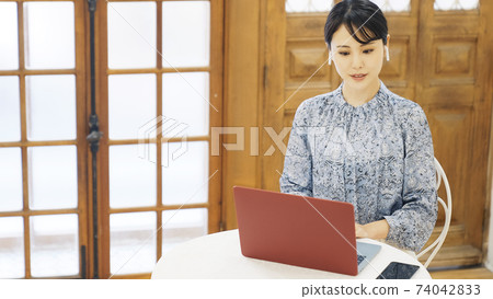 Female telework remote work speaking on a video call 74042833