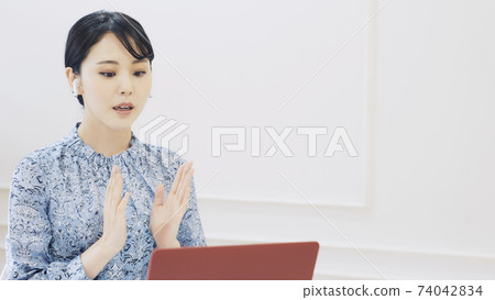 Female telework remote work speaking on a video call 74042834