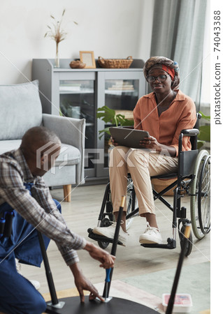 Wheelchair User Ordering Home Repair Services 74043388