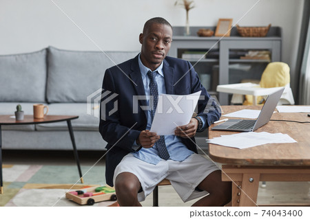 African Man Wearing Jacket and Shorts for Online Meeting 74043400