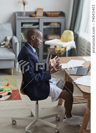 African Man in Casual Online Meeting African Man in Casual Online Meeting 74043401