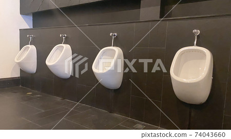 Men's white urinals design, Close up row of outdoor urinals men public toilet, Expulsion from the body, Urinals for men, Urinal concept. Men's white urinals design, Close up row of outdoor urinals men public toilet, Expulsion from the body, Urinals for men, Urinal concept. 74043660