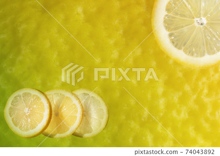 Lemon slices on a yellow background Lemon slices on a yellow background 74043892