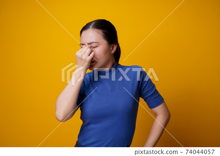 Asian woman was sick with eyes pain. 74044057