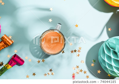 Carnival food TYPICAL and carnival mask. Sfrappole or chiachiere or angel wings and aromatic coffee 74044185