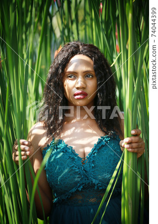 Portrait of afro American women posing at outdoor. 74044399