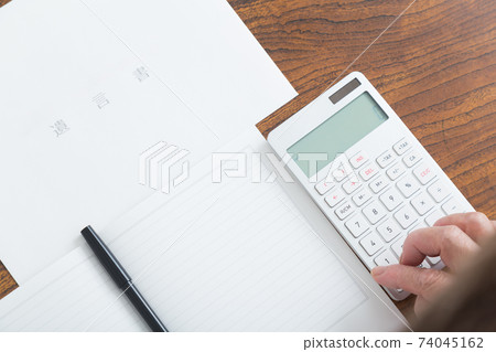 Senior woman writing a will 74045162