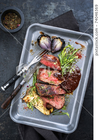 Italian barbecue dry aged sliced chateaubriand with mushroom  74046369