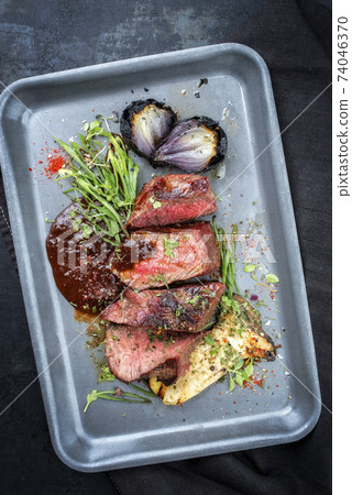 Italian barbecue dry aged sliced chateaubriand with mushroom  74046370