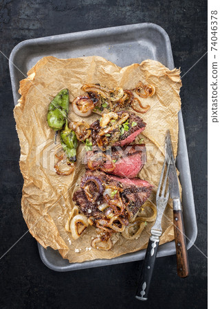 barbecue sliced rostbraten with fried mushrooms and paprika  74046378