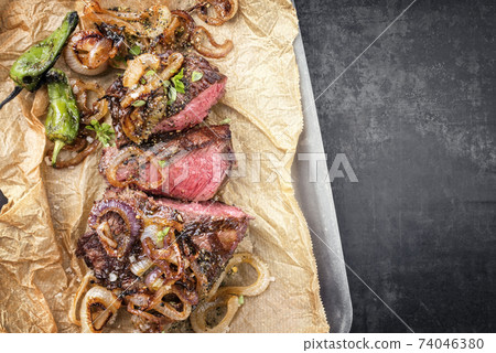barbecue sliced rostbraten with fried mushrooms and paprika  74046380