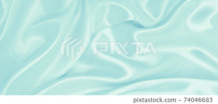 Smooth elegant blue silk or satin luxury cloth texture as abstract background. Luxurious background design Smooth elegant blue silk or satin luxury cloth texture as abstract background. Luxurious background design 74046683
