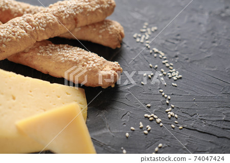 gluten free bread sticks with sesame seeds. 74047424