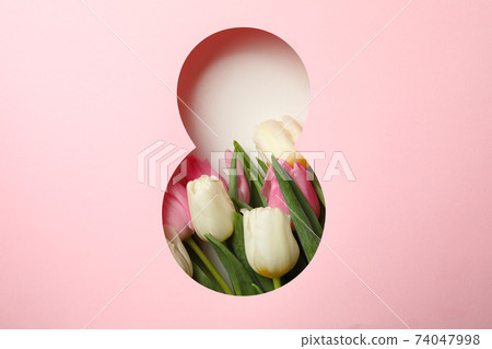 Paper cut Eight made of pink background and tulips on white background 74047998