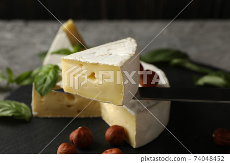 Tray and knife with camembert, close up Tray and knife with camembert, close up 74048452