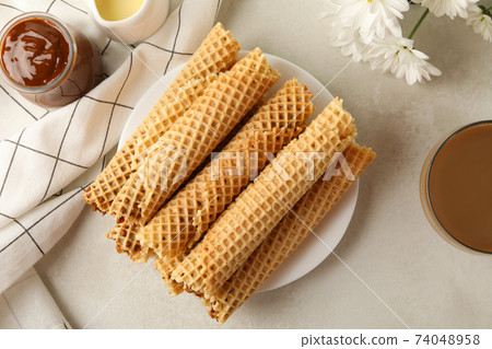 Tasty wafer rolls with condensed milk Tasty wafer rolls with condensed milk 74048958