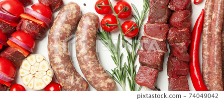 Set of different raw barbecue meat on white background, top view 74049042