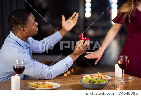 Proposal Rejection. Woman Leaving Black Boyfriend In Restaurant After He Proposed Marriage Proposal Rejection. Woman Leaving Black Boyfriend In Restaurant After He Proposed Marriage 74049389