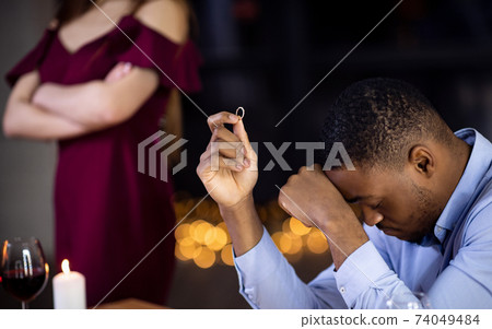 Desperate Black Man Sitting With Ring In Hand After Girlfriend Refused Proposal Desperate Black Man Sitting With Ring In Hand After Girlfriend Refused Proposal 74049484