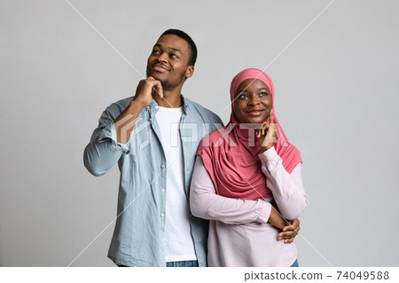 African american lovers dreaming about something on grey African american lovers dreaming about something on grey 74049588