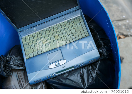 Old computer notebook put into Dustbin 74051015