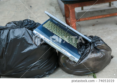 Old computer notebook put into Dustbin 74051019