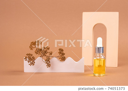 Mockup dropper bottle of organic cosmetics - polyglutamic or hyaluronic acid, serum, moisturizer or facial anti-aging oil. Essential oil in trendy neutral biege still life composition Mockup dropper bottle of organic cosmetics - polyglutamic or hyaluronic acid, serum, moisturizer or facial anti-aging oil. Essential oil in trendy neutral biege still life composition 74051373