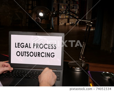 Legal process outsourcing data and rules on the laptop. 74051534