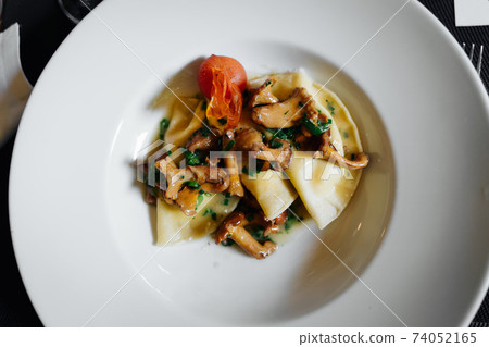a maultaschen plate with mushrooms on top a maultaschen plate with mushrooms on top 74052165
