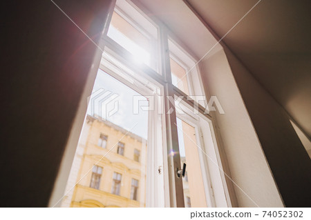 a photo of an old building staircase window 74052302