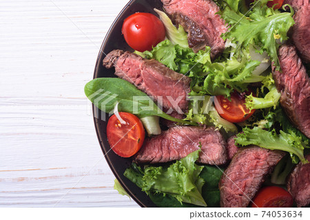 Salad with grilled beef medium roast Salad with grilled beef medium roast 74053634
