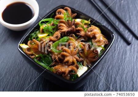 Baby octopus fried with lemon 74053650
