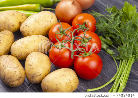 raw vegetables before cooking for frying and braising in a pan raw vegetables before cooking for frying and braising in a pan 74054014