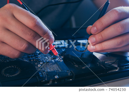 computer hardware engineering. developer soldering electronic component 74054230