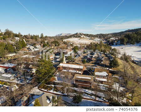 Aerial view of historic Downtown City of Julian during snow day. Aerial view of historic Downtown City of Julian during snow day. 74054376