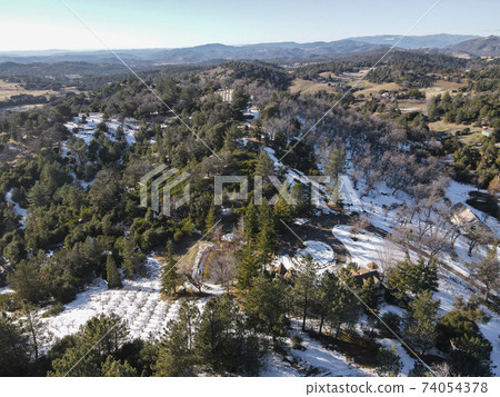 Aerial view of historic Downtown City of Julian during snow day. Aerial view of historic Downtown City of Julian during snow day. 74054378