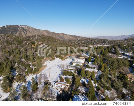 Aerial view of historic Downtown City of Julian during snow day. Aerial view of historic Downtown City of Julian during snow day. 74054384