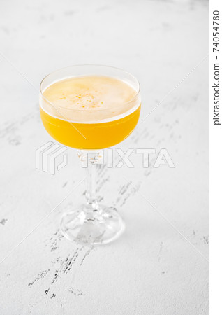 Glass of Algonquin cocktail 74054780