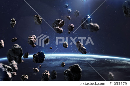 Asteroids near Earth. Meteorites orbiting planet. Deep space image, science fiction fantasy in high resolution ideal for wallpaper and print. Elements of this image furnished by NASA 74055379