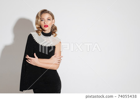 Fashionable woman with large necklace over the 74055438